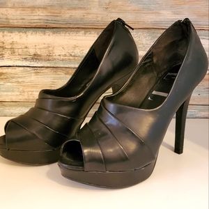 Women's black 4 inch platform heels, size 7.